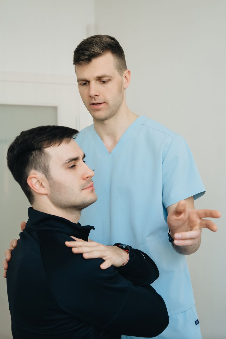 An IRI clinician carrying out an objective assessment with a patient